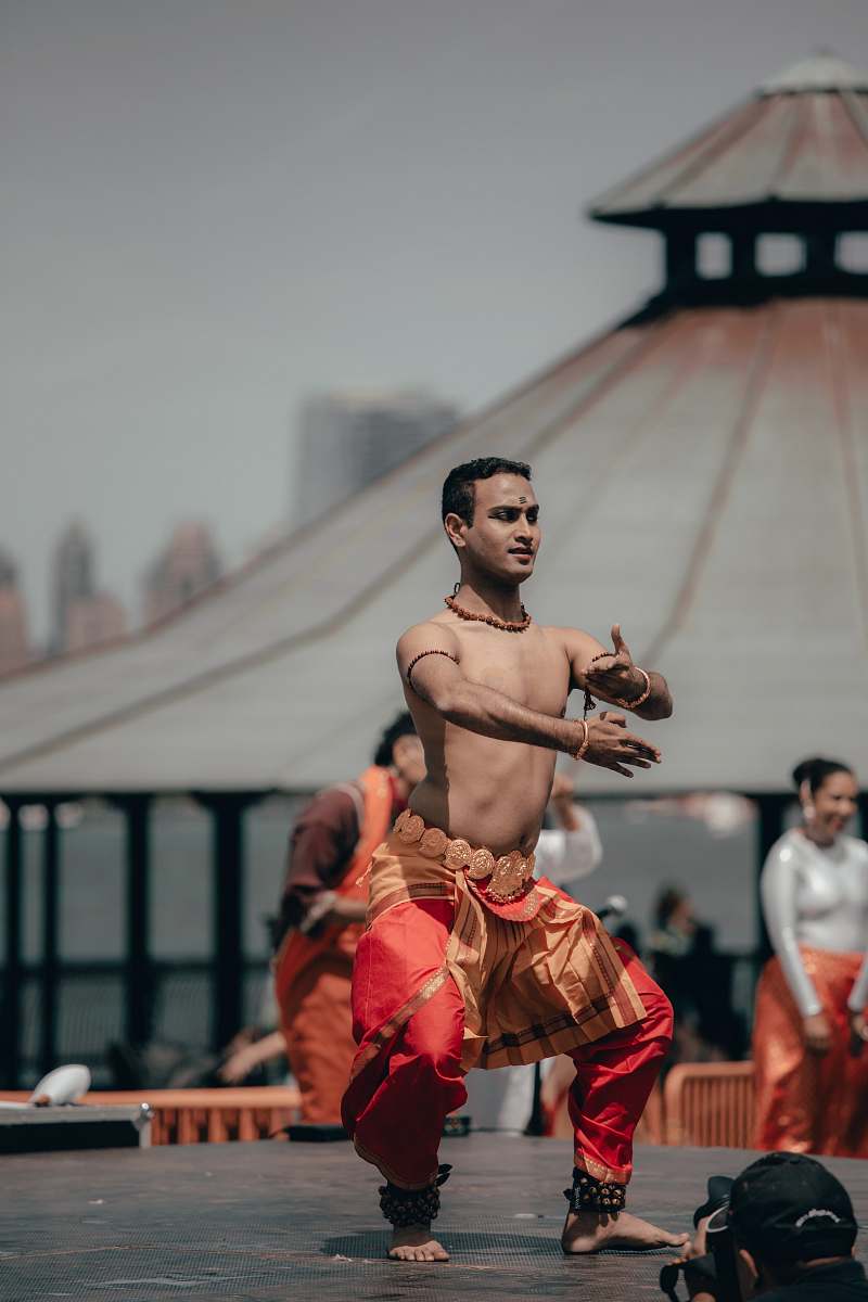 dance pose man wearing red and orange pants leisure activities